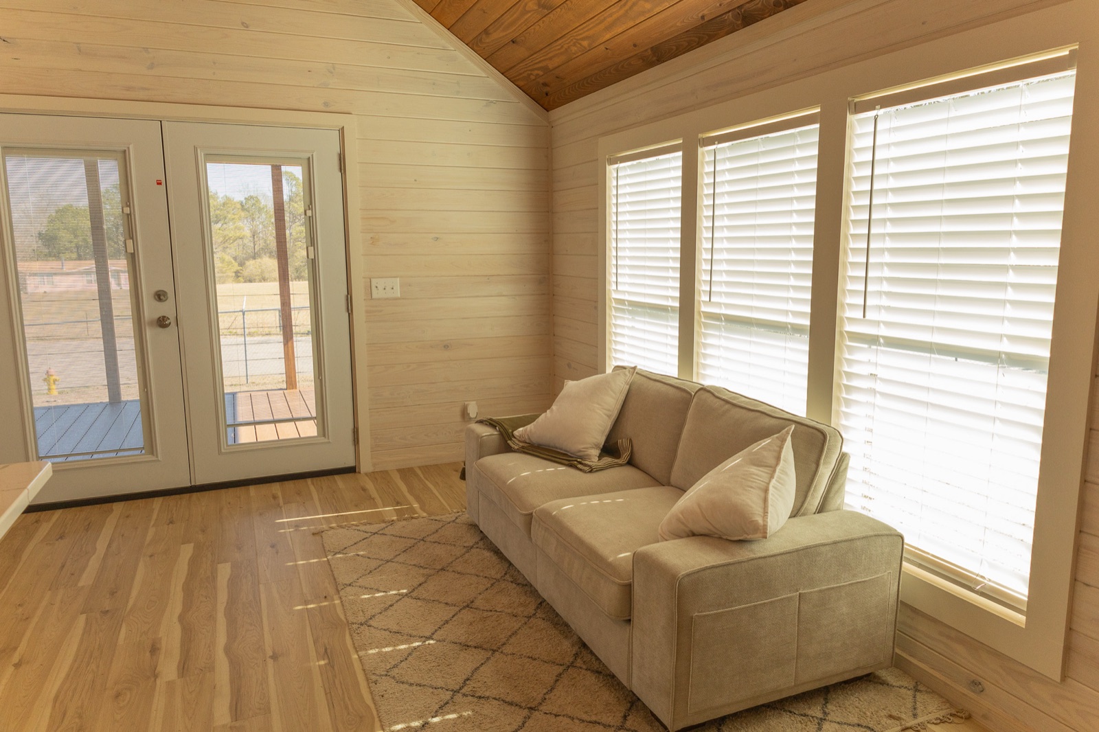 Lofted Farmstead — Living area & porch door