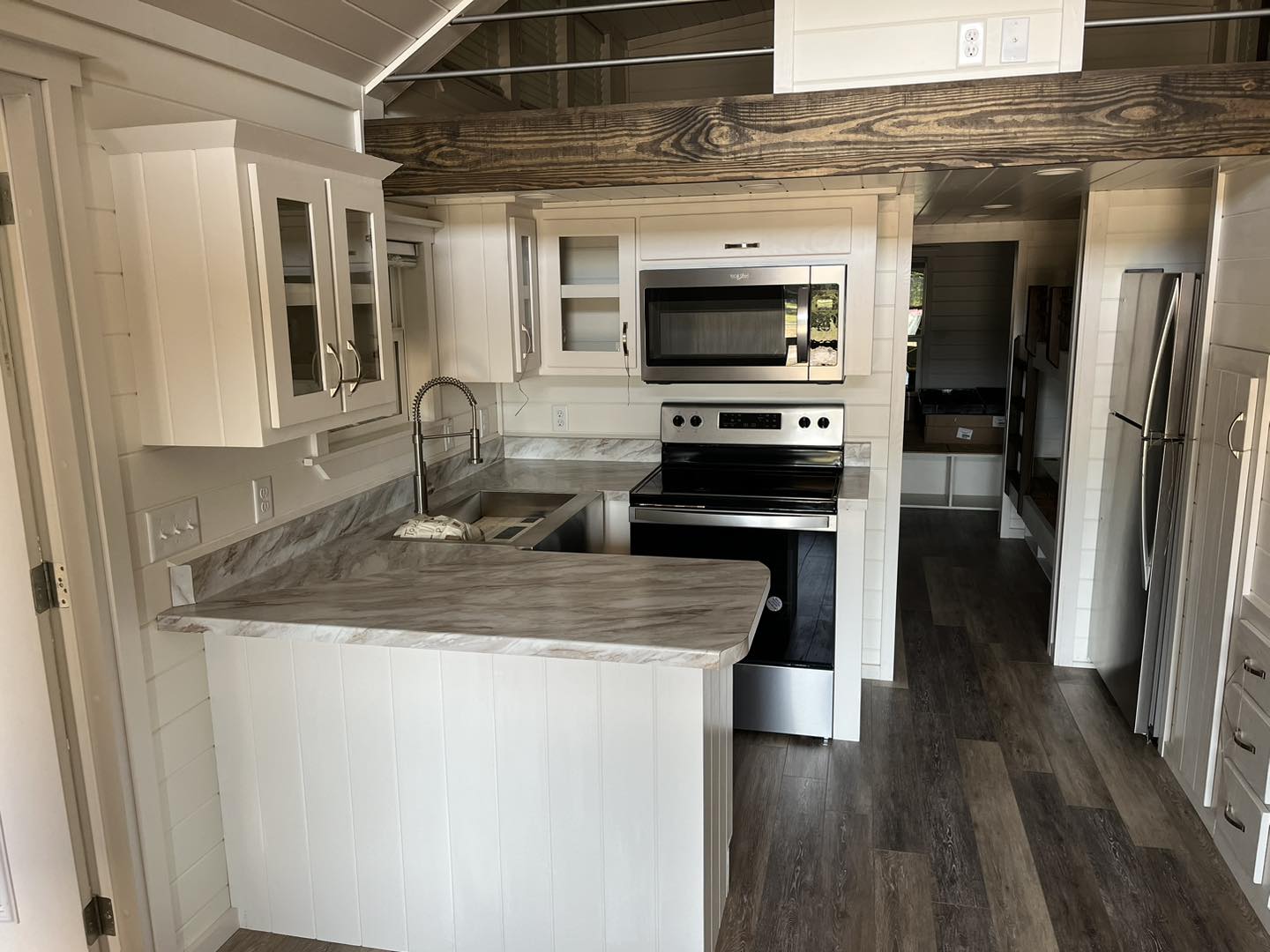 ACC-02 — full kitchen with peninsula seating and stainless appliances