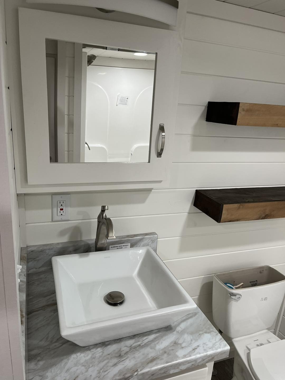 ACC-02 — bathroom with vessel sink and floating shelves