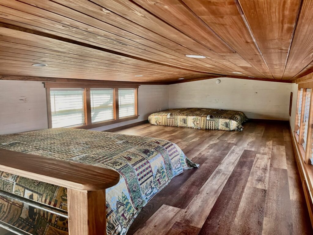 ACC-04 — loft sleeping area with cedar ceiling