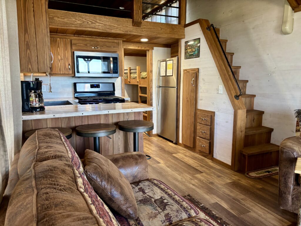ACC-04 — open living, kitchen and loft staircase