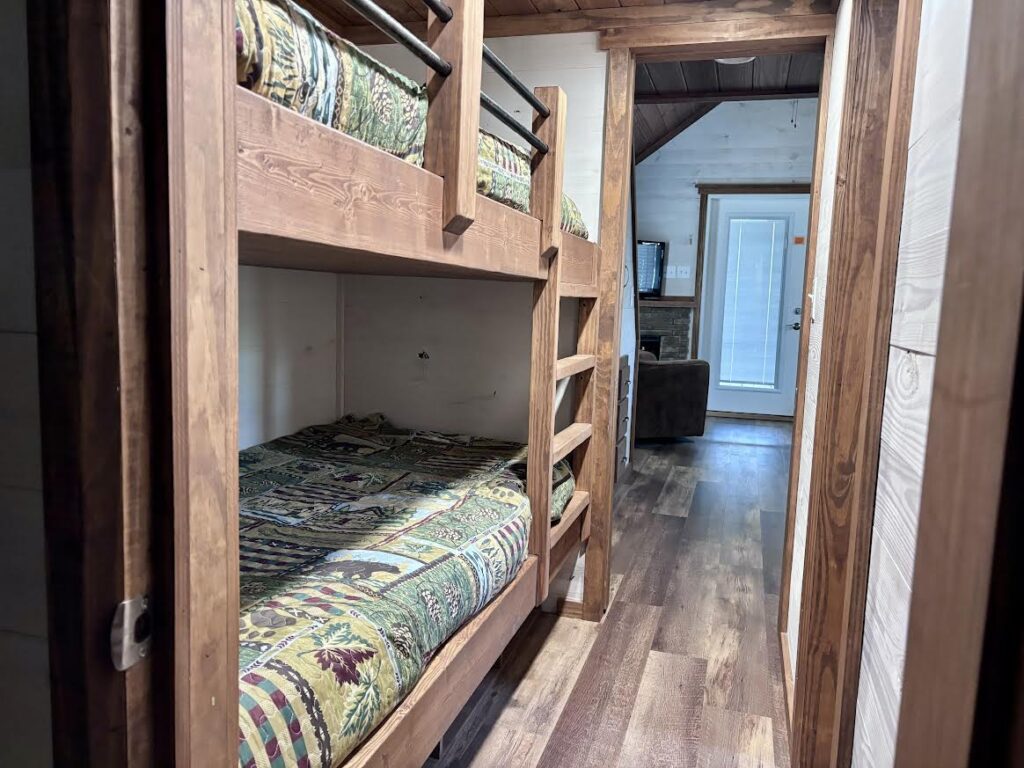 ACC-04 — bunk room with built-in wood bunks