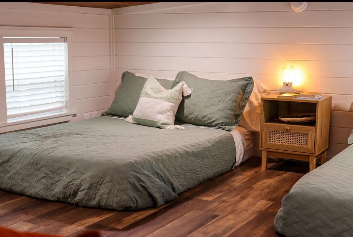 Kelsey 1.0 — bedroom with queen bed and nightstand