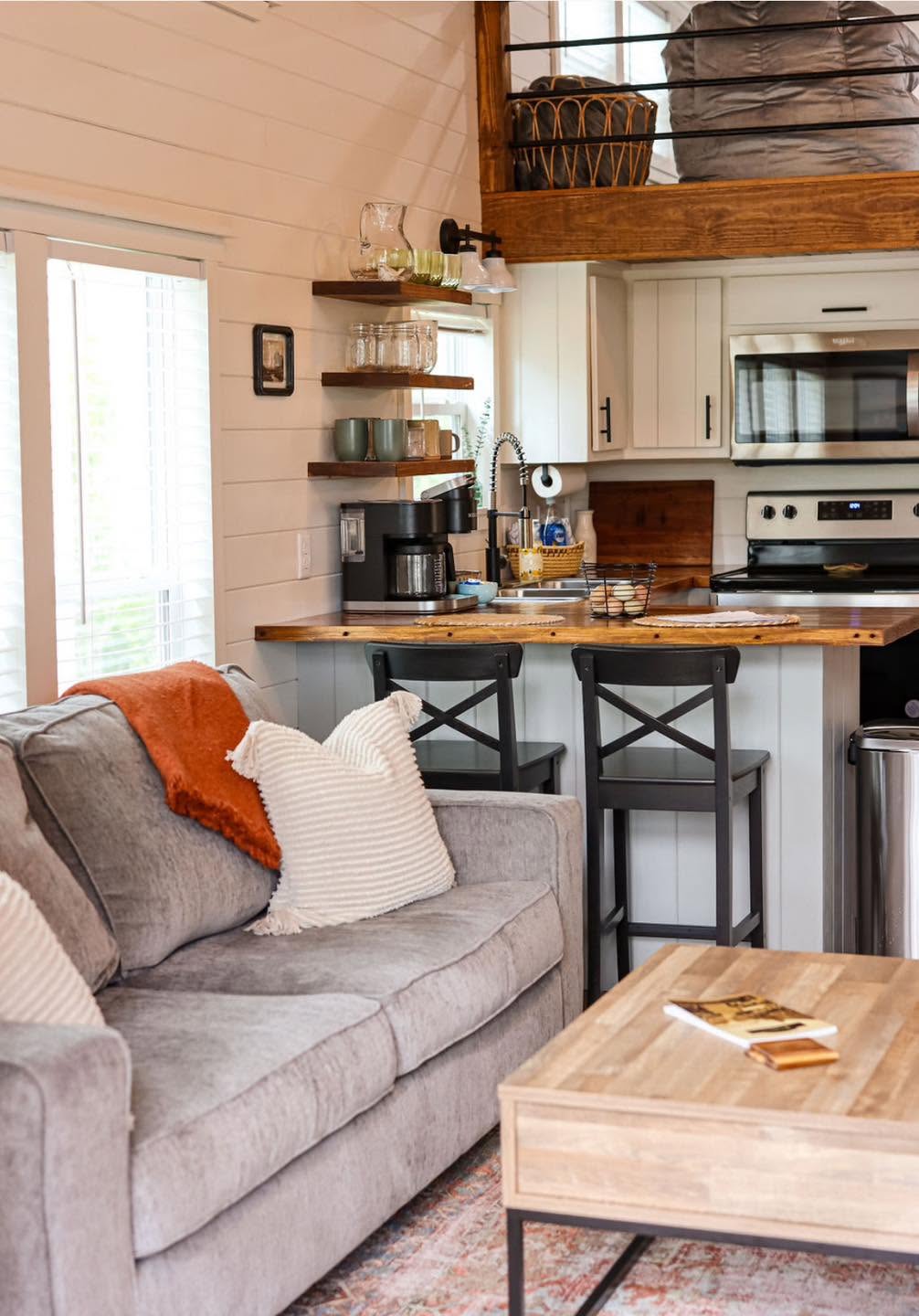 Kelsey 1.0 — living room and kitchen beneath the loft