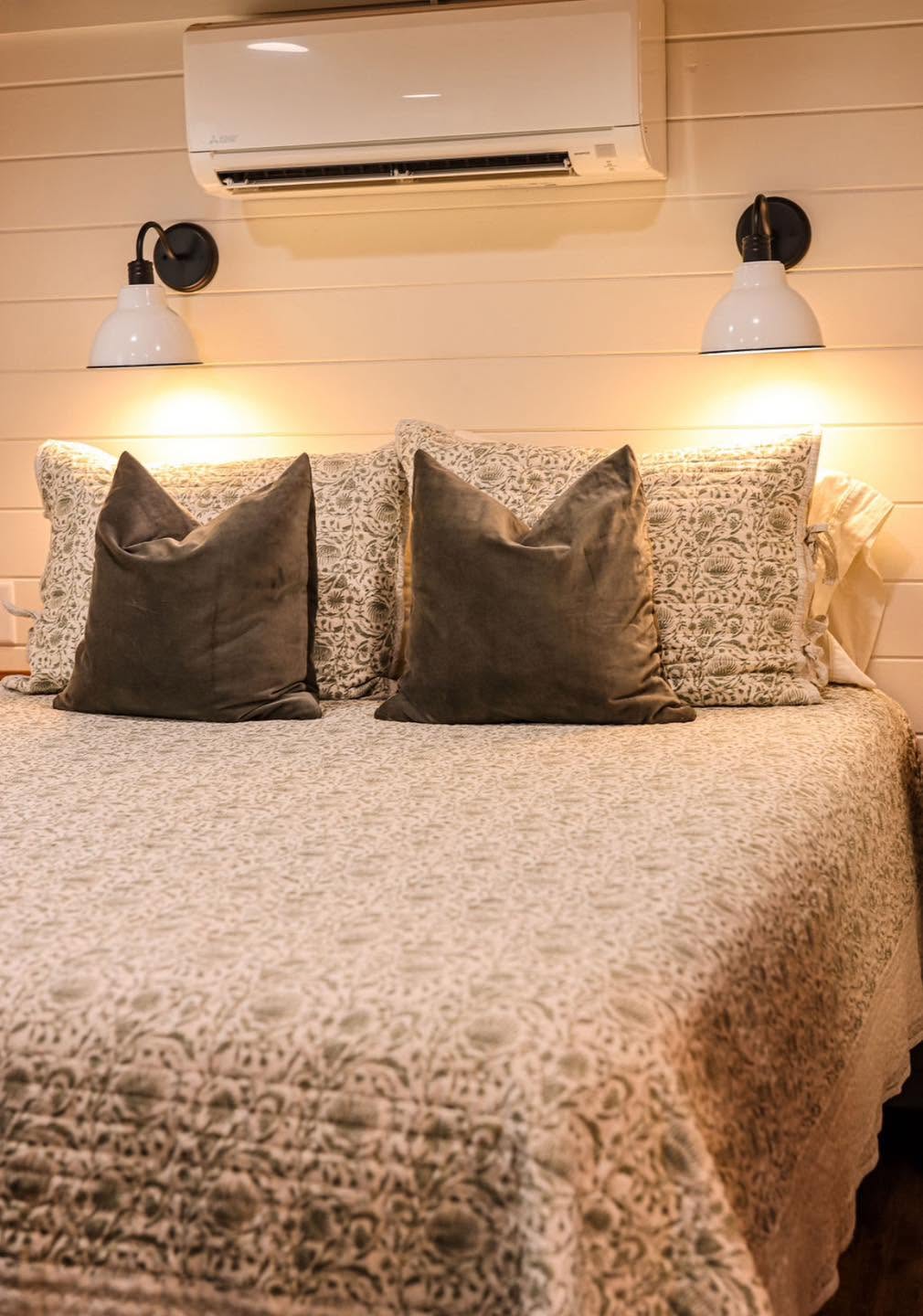 Kelsey 1.0 — bedroom detail with wall sconces and mini-split