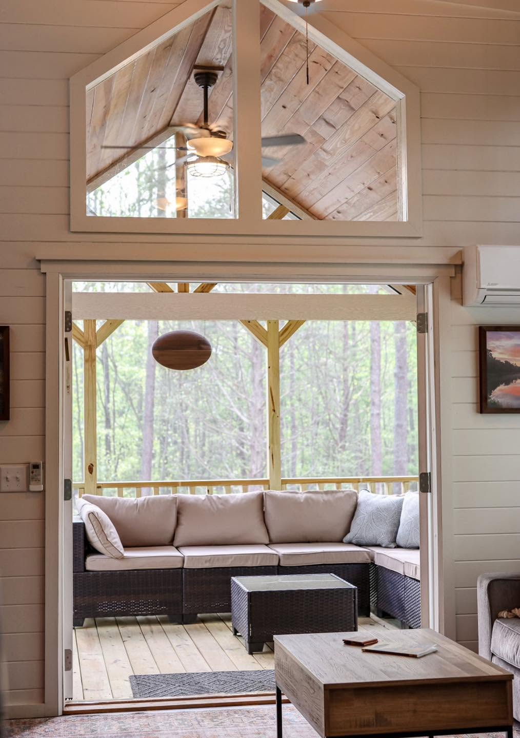 Kelsey 1.0 — living room opening to the screened porch