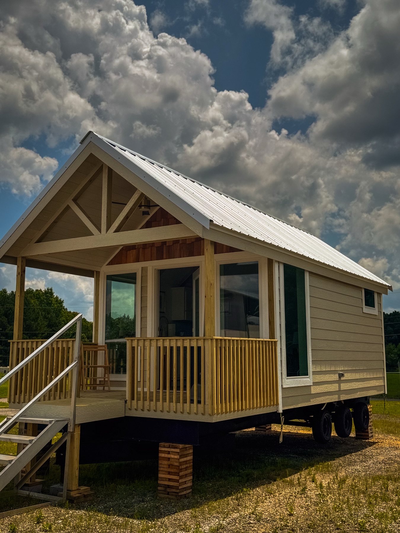 The Nest — exterior with open porch and metal roof